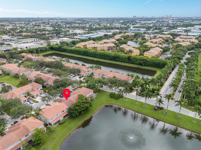 drone / aerial view with a water view and a residential view