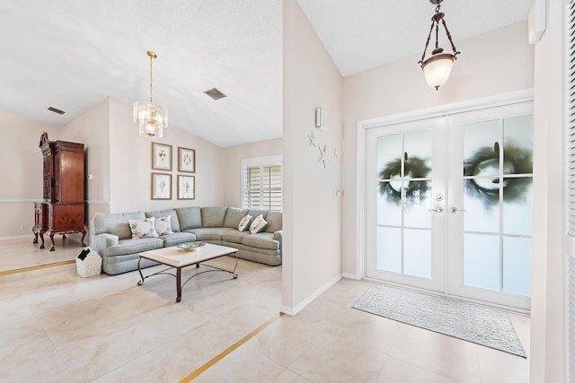 living area featuring vaulted ceiling, a notable chandelier, baseboards, and visible vents