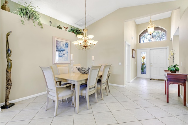 dining space featuring high vaulted ceiling, light tile patterned flooring, a notable chandelier, and baseboards