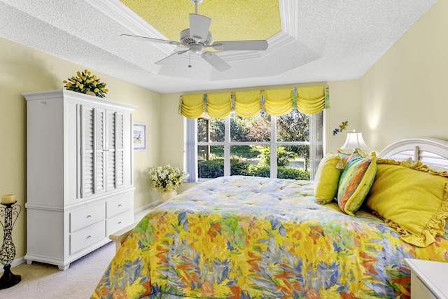 carpeted bedroom with baseboards, a ceiling fan, and a textured ceiling