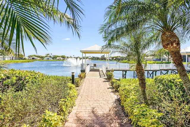 view of dock featuring a water view and a gazebo