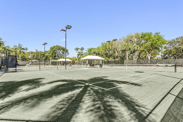 view of sport court with fence