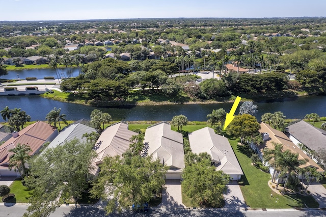 drone / aerial view featuring a residential view and a water view