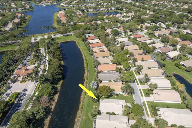 bird's eye view featuring a water view and a residential view