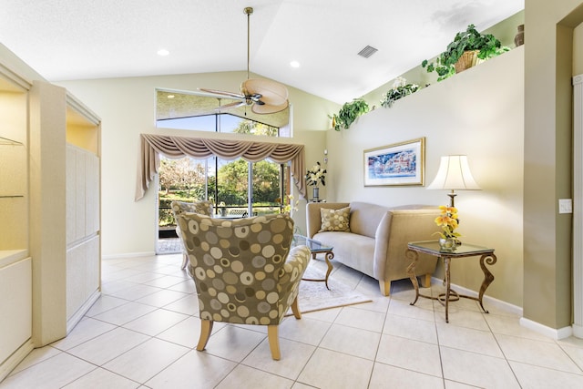 living area with lofted ceiling, light tile patterned floors, baseboards, and a ceiling fan