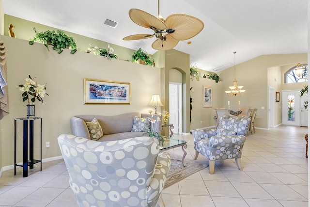 living area featuring visible vents, light tile patterned flooring, vaulted ceiling, baseboards, and ceiling fan with notable chandelier