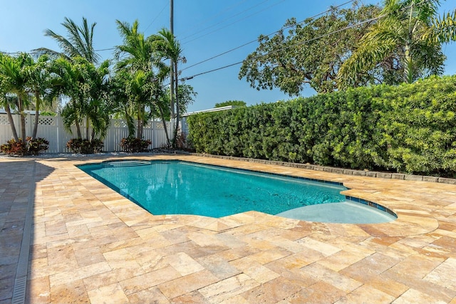 view of swimming pool with a fenced backyard, a fenced in pool, and a patio