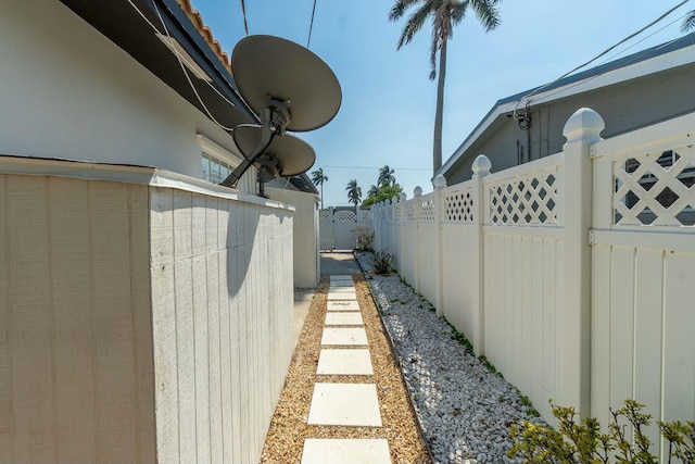 view of side of property featuring fence