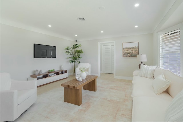 living room with recessed lighting, light carpet, visible vents, and baseboards