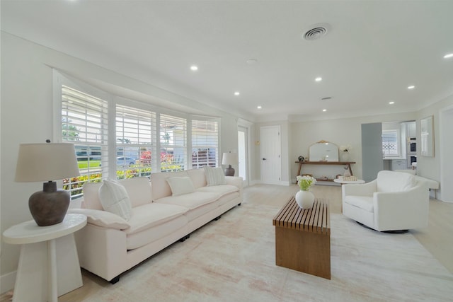 living room with recessed lighting and visible vents