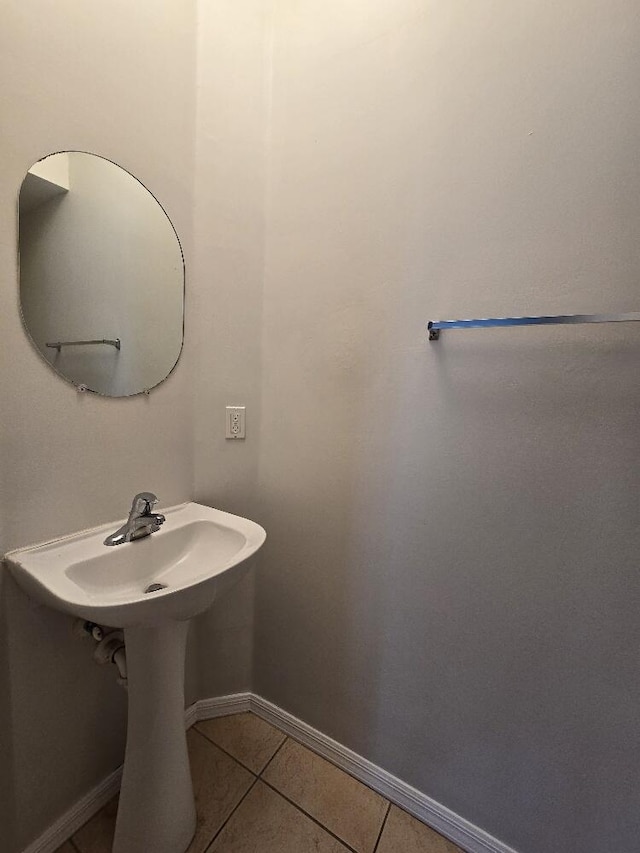 bathroom with tile patterned flooring and baseboards