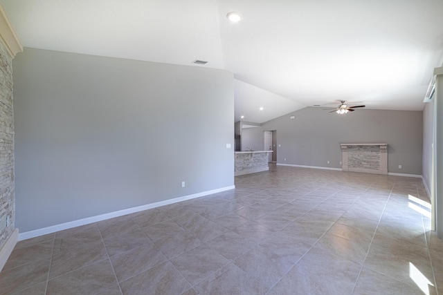 unfurnished living room with ceiling fan, light tile patterned flooring, a fireplace, visible vents, and vaulted ceiling