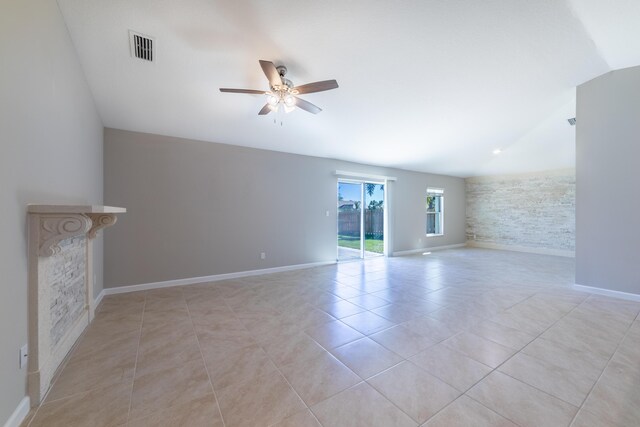 carpeted empty room with baseboards, visible vents, and ceiling fan