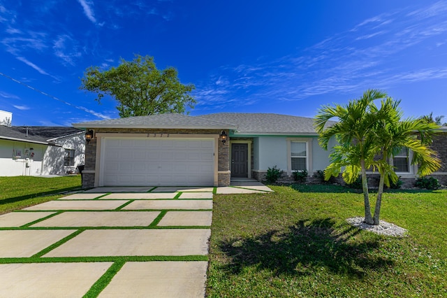 ranch-style home with a garage, concrete driveway, a front lawn, and stucco siding