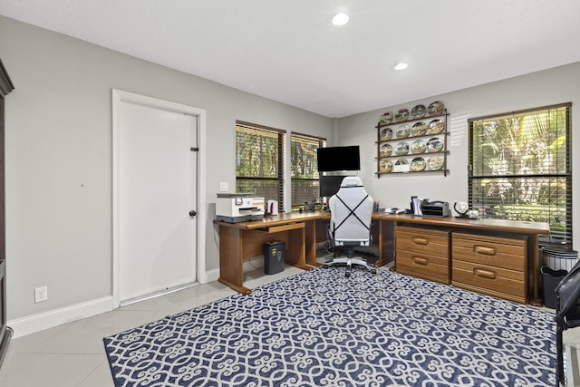 office space with tile patterned floors, recessed lighting, and baseboards