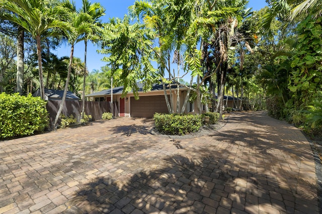 view of home's exterior featuring fence