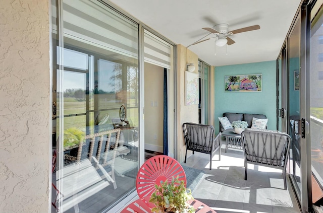 balcony featuring ceiling fan and an outdoor hangout area