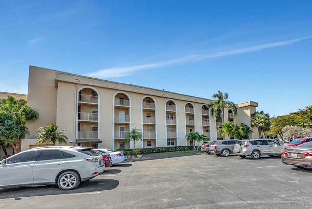 view of property with uncovered parking