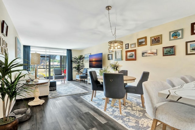 dining space with dark wood-style floors and a wall of windows