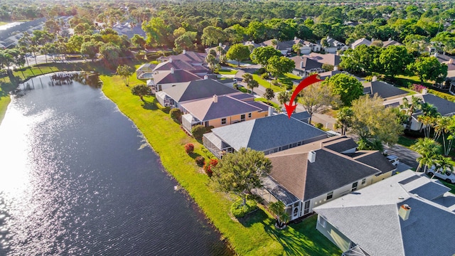 bird's eye view with a water view and a residential view