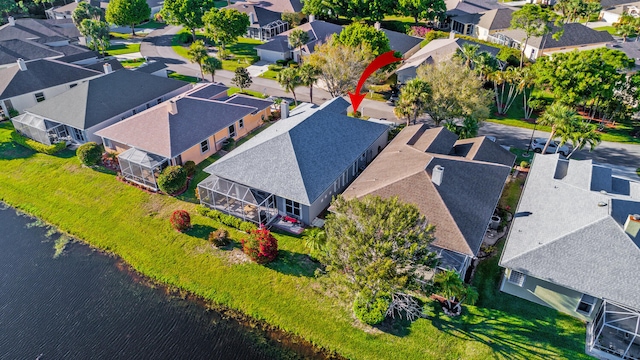 aerial view with a water view and a residential view