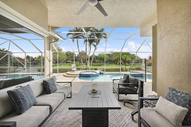 view of patio featuring a ceiling fan, a pool with connected hot tub, an outdoor living space, and a lanai