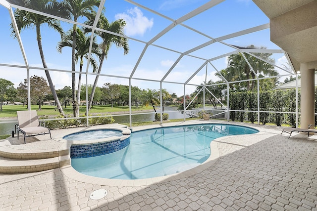 view of swimming pool with glass enclosure, a pool with connected hot tub, and a patio