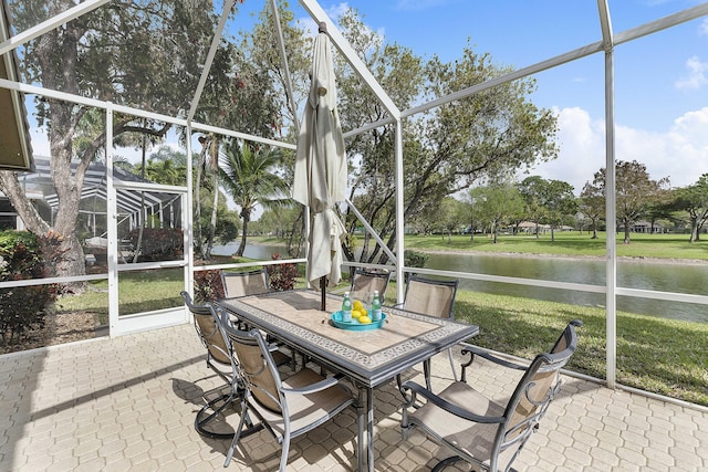 sunroom / solarium with a water view