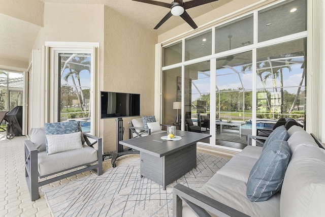 view of patio with ceiling fan and an outdoor hangout area