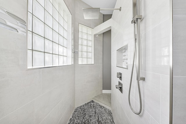 bathroom with tiled shower