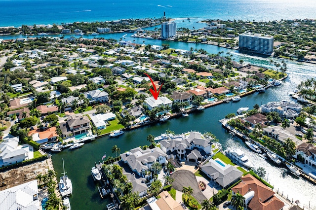 bird's eye view featuring a residential view and a water view