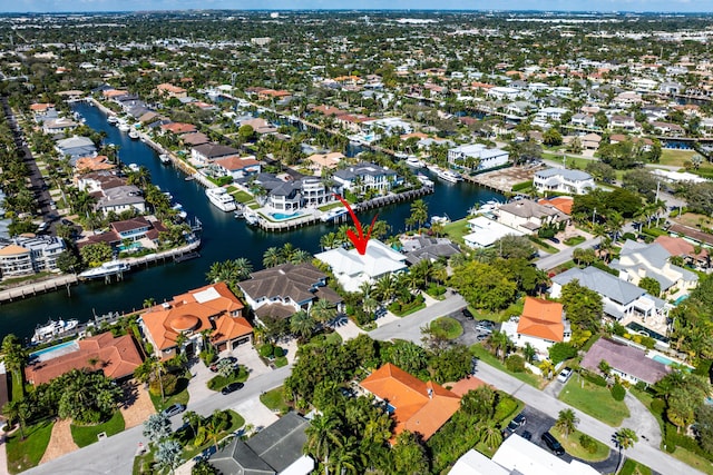 birds eye view of property featuring a residential view and a water view