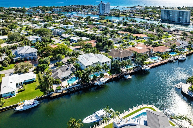 birds eye view of property with a water view and a residential view