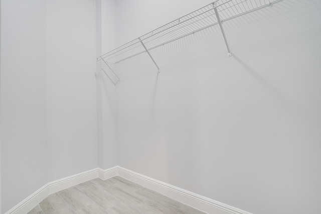 spacious closet with light wood-type flooring