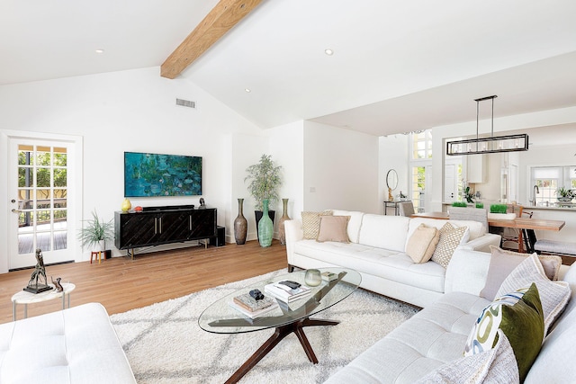 living room with visible vents, high vaulted ceiling, light wood-style flooring, recessed lighting, and beamed ceiling