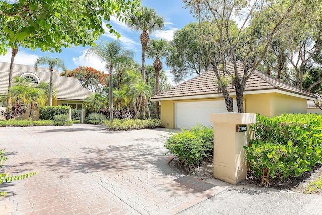 view of front of property with stucco siding and a garage