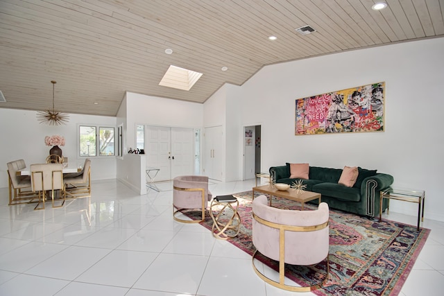 living room with light tile patterned flooring, visible vents, a skylight, and wood ceiling