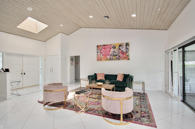 living area featuring light tile patterned floors, visible vents, a skylight, recessed lighting, and wooden ceiling