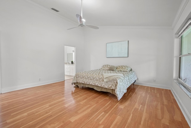 bedroom featuring lofted ceiling, light wood-style flooring, a ceiling fan, baseboards, and ornamental molding