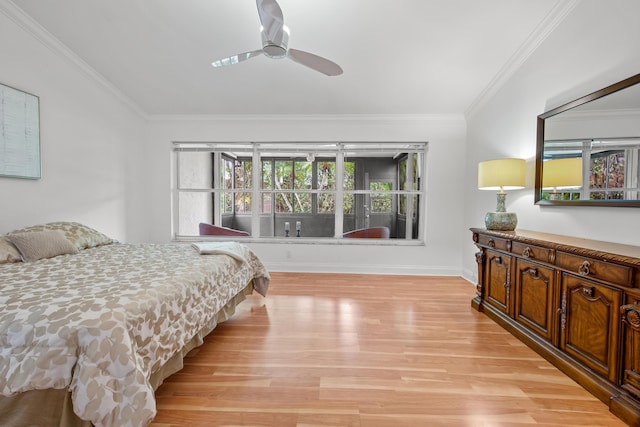 bedroom with ornamental molding, ceiling fan, light wood-style flooring, and baseboards