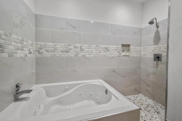 full bath featuring tiled shower and a tub with jets