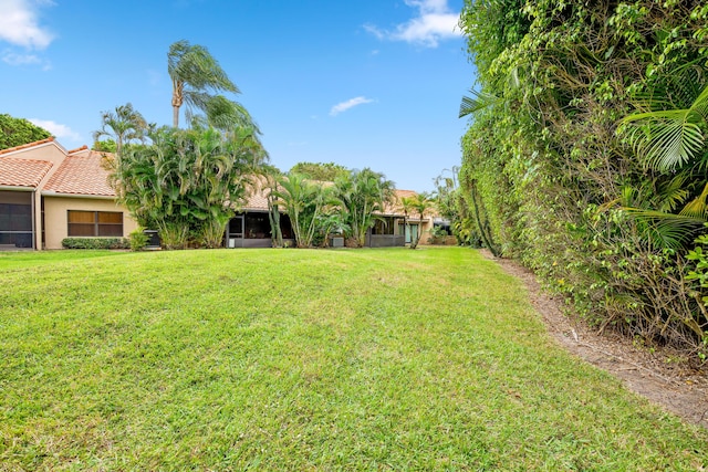 view of yard with a sunroom