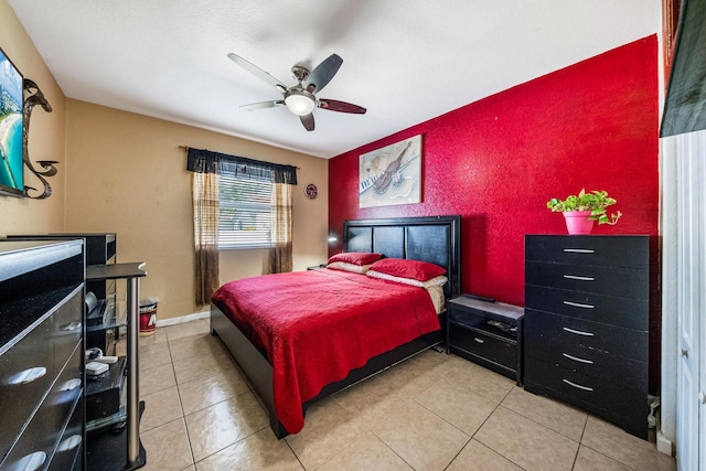 bedroom with light tile patterned floors and a ceiling fan