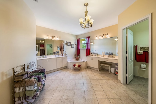 full bath featuring a garden tub, an inviting chandelier, vanity, and tile patterned flooring