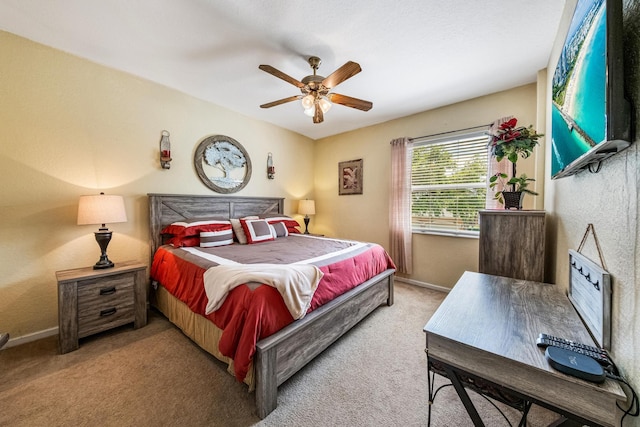 bedroom featuring a ceiling fan, baseboards, and carpet floors