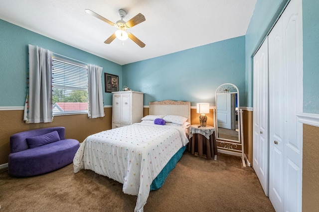 carpeted bedroom with a closet and ceiling fan