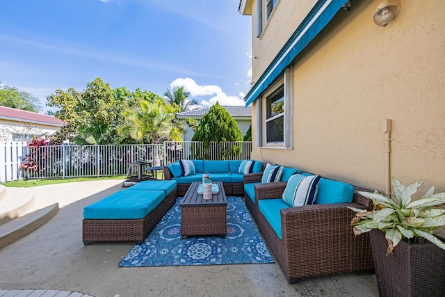 view of patio with fence and an outdoor hangout area