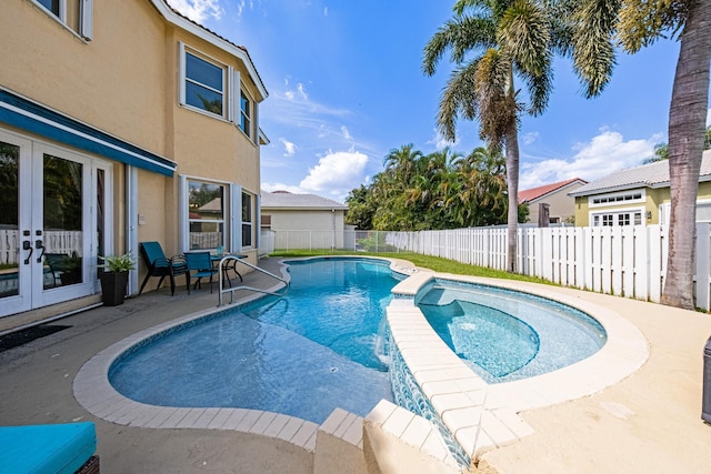 view of pool with a patio area, french doors, a fenced in pool, and a fenced backyard