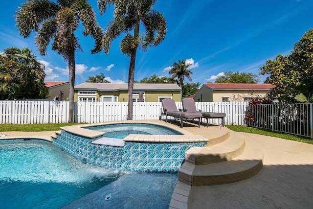 view of pool with a fenced in pool, a patio, an in ground hot tub, and a fenced backyard