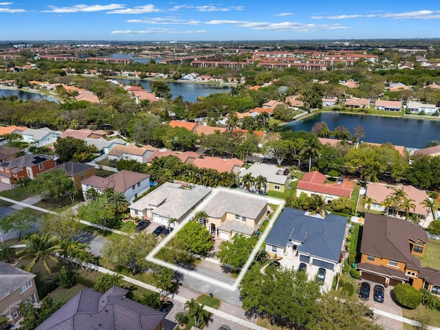 birds eye view of property with a residential view and a water view